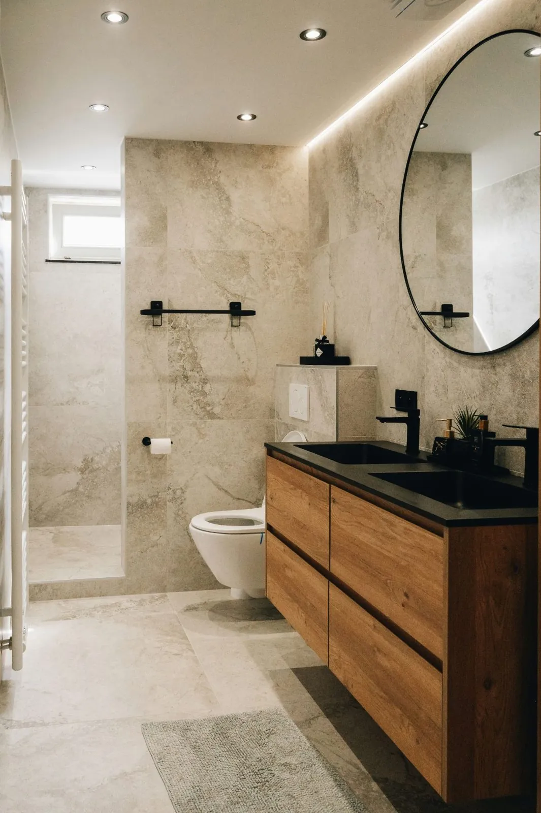 Modern bathroom with a wall-hung toilet and timber vanity unit